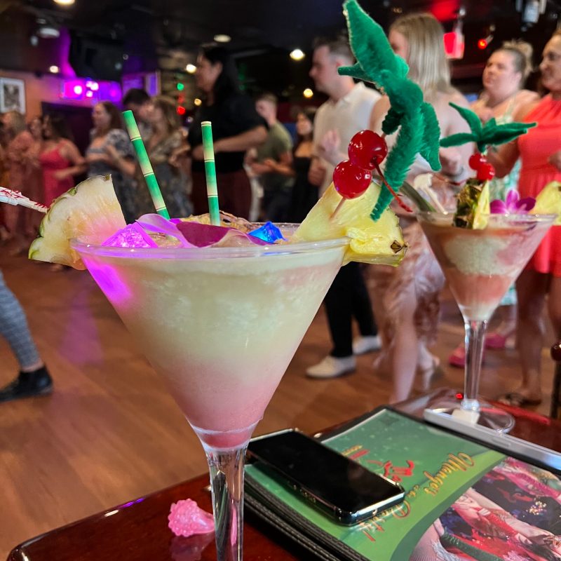 a group of people sitting at a table with wine glasses