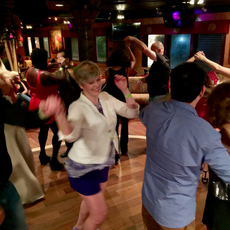 a group of people standing in front of a crowd