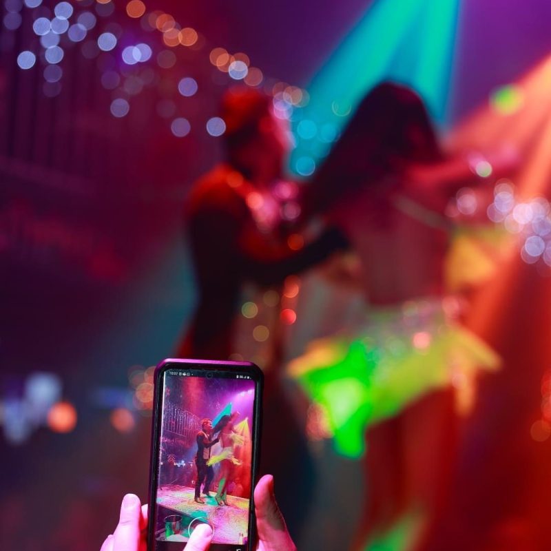 a hand holding a small stage