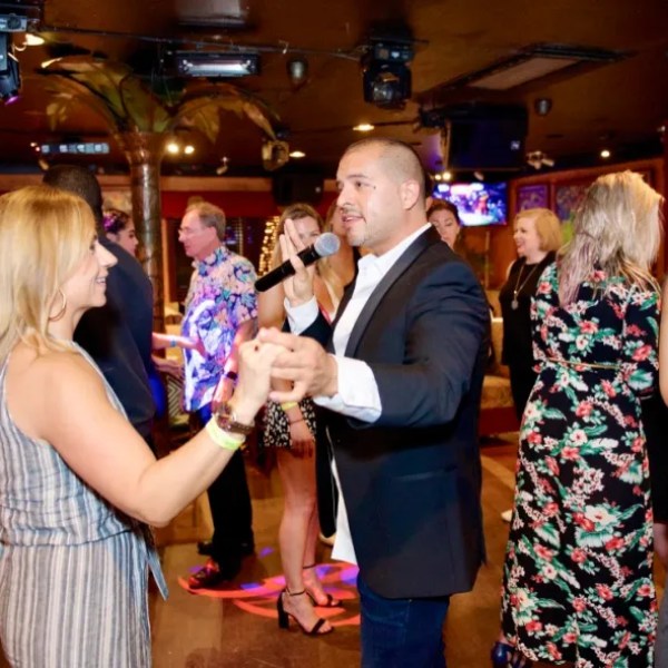Interactive salsa lesson host leading corporate event team building experience in Miami Beach