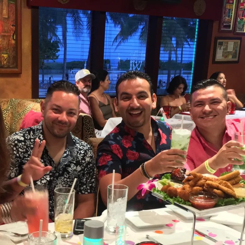 Group enjoying a Miami Beach night out with food, drinks and salsa dancing at Salsa Mia